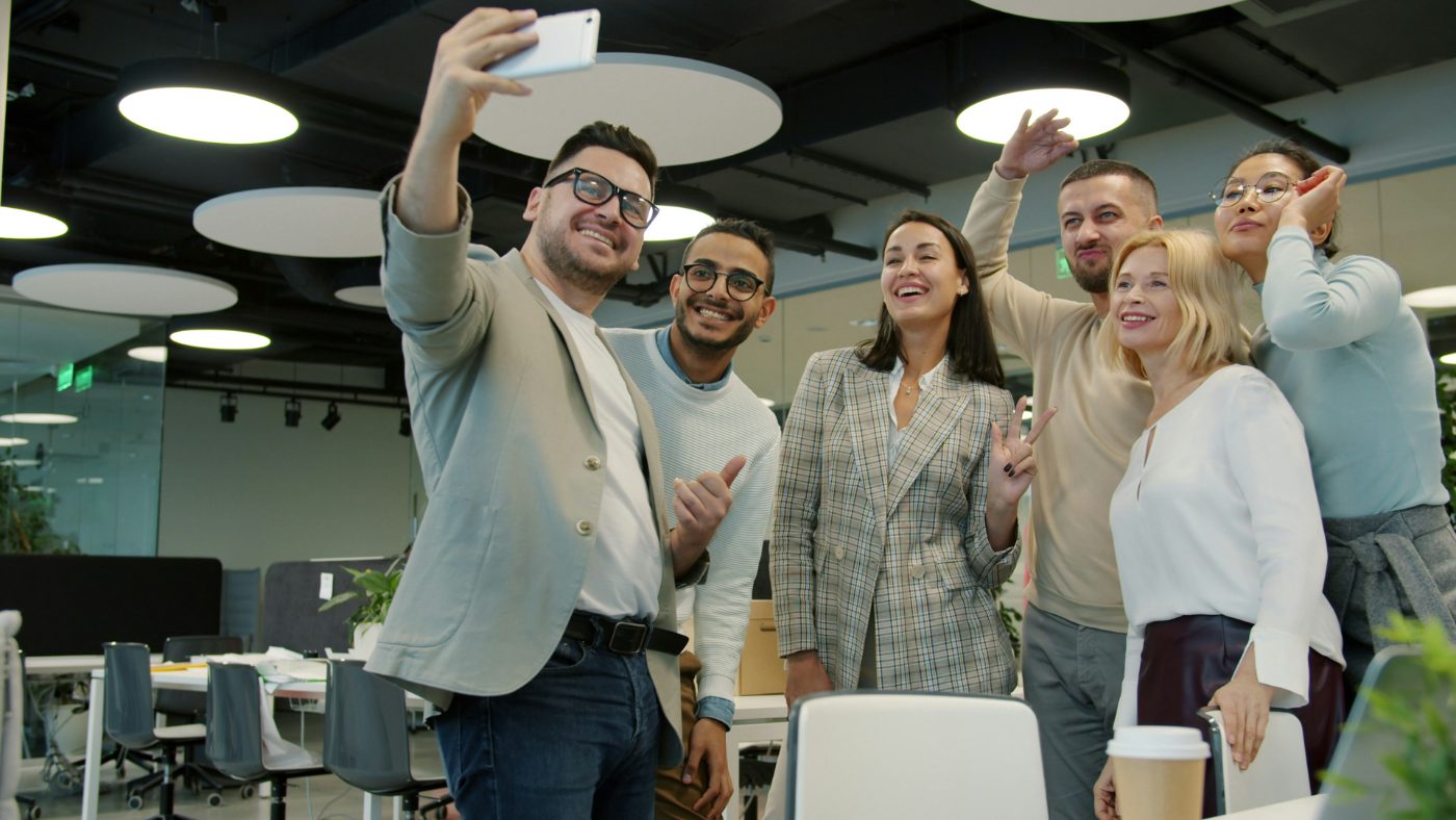 Team taking a group photo in the office